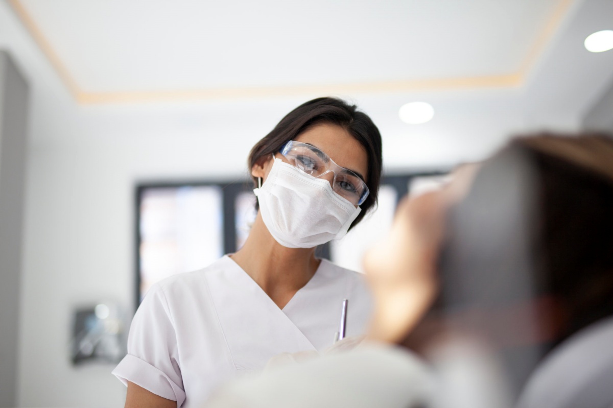 Nurse in a mask representing using an SBA loan for a dentist practice