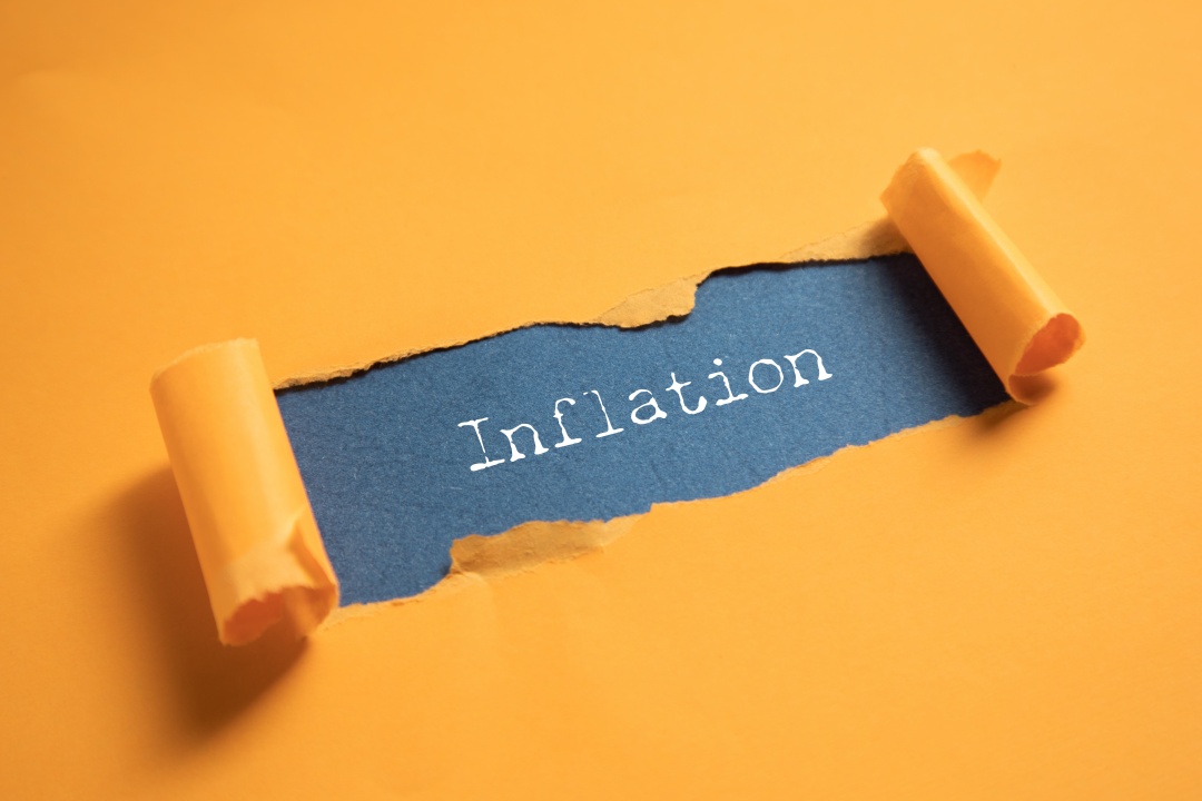 The word "inflation" showing under paper cover up.